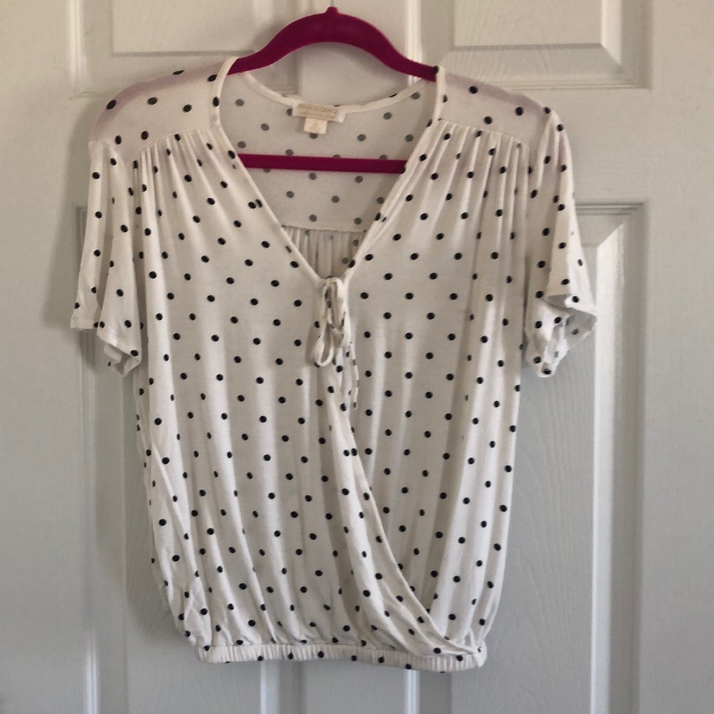 Ivory and black polka dot shirt.